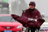 Chinese Going Their Way On Bicycle Amid Heavy Rain