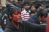 A Muslim Bleeds By Flagellating Himself During Muharram Procession In Srinagar, India