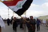A Iraqi Protester Waves National Flag During Demonstration In Ramadi Near Baghdad