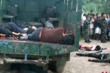 Bodies Of Nine People Killed In An Ambush By Gunmen Lie Along The Road In Central Philippines