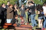 Relatives And Friends Dance Next To The Coffin Of A Nightclub Fire Victim At Cemetery In Santa Maria