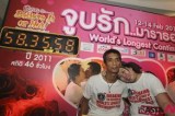 A couple celebrates after winning world’s longest kiss contest in Pattaya