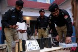 Police display weapons seized while being smuggled from Peshawar to Punjab