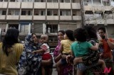 Pakistani people evacuate building as strong earthquake hits Iran