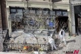 Men in hazmat suits investigate Boston Marathon bombing scene
