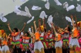Villagers of Zhuang ethnic group perform for tourists in Yunnan