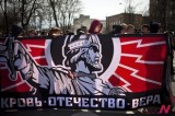 Russian nationalists carry old Empire flag while marching for May Day