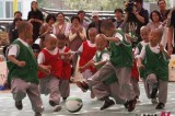 Shaven-headed little monks play soccer to celebrate Buddha’s birthday