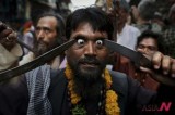An Indian Muslim Sufi holy man self-flagellates with sharp objects