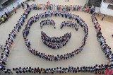 Chinese pupils form a smiling face to celebrate National Day in Wuyuan