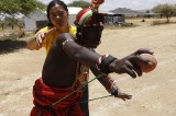 Maasai Warriors Grasp Cricket Bats Instead of Spears