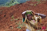 Ugandan Woman Looks For Her Children Lost In Landslide