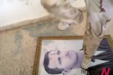 A Syrian Rebel Tramples Picture Of Assad