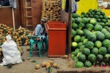 Indonesian Fruit Vendor Waits For Customers