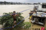 People Escape From Flooded Region Near Manila