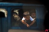 NK Kid Being Moved From Flood-Stricken Region In A Truck