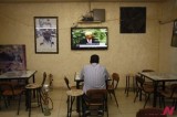 A Palestinian Man Glued To TV Showing His President Addressing At UNGA