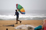 An India Boy Walks Along The Coast As Cyclone Nilam Approaches
