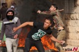 Palestinian Protesters Throw Stones Toward Israeli Soldiers During Clashes