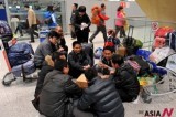 Passengers Play Card At Airport In Kunming Due To Flight Cancellation By Dense Fog