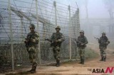 Indian Soldiers Patrol Along The Fence Near India-Pakistan Border In Kashmir