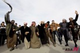 Protesters Dance During Demonstration By Thousands Of Iraqi Sunnis In Ramadi, West Of Baghdad