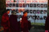 Exile Tibetan monks attend a candlelit vigil to enhance solidarity with those in home country