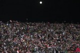 Football fans cheer under the moonlight during an int’l soccer friendly in Baghdad
