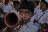 A young Hindu nationalist plays bugle to mark Hindu new year