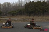 North Korean soldiers enjoy racing on a go cart track in Pyongyang