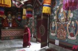 A monk walks inside Buddhist monastery in Dratshang, Bhutan