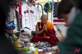 A monk prays for victims of Boston bombings at makeshift memorial