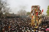 Indian people surrounding warrior god idol celebrate eunuch festival