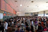 Chinese passengers line up for train tickets for 3-day May 1st holidays