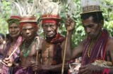 Indonesian tribesmen wear traditional outfits for ritual ceremony