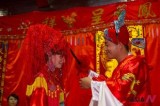 Chinese bridegroom unveils for Russian bride at traditional wedding
