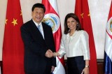 Chinese President Xi shakes hands with Costa Rican President Chinchilla