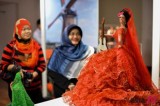 Visitors watch dolls at World Costumes Dolls Exhibition held in Kuala Lumpur