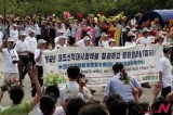 Participants march to mark N. Korea’s 60th anniversary of end of Korean War