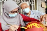 In Malaysia, Cheng, Azizah connect through Chinese calligraphy
