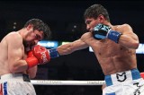 Uzbek boxer Murodjon Akhmadaliev defends his IBF, WBO featherweight titles