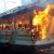 A city bus is burning after the opposition activists set it on fire.
