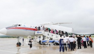 Chinese tourists are boarding into an airplane toward Pyeongyang, North Korea at the Yanji Airport, China.
