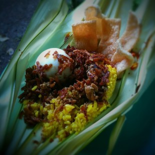 Nasi Kuning wrapped with palm leaf (Photo: www.foodspotting.com)