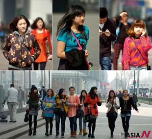 Young women begin wearing spring clothing as it gets warm in Nanjing, China