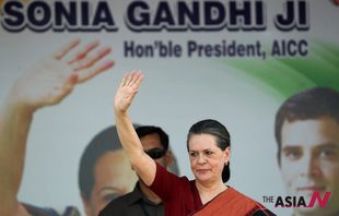 India’s ruling Congress chief Sonia Gandhi waves to supporters