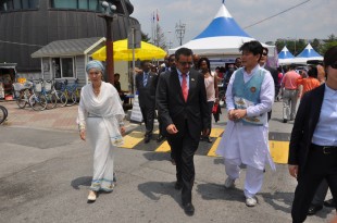 Korean woman and her Korean husband in Ethiopian Traditional clothes accompanying Dr. Tedros to their ‘Ethiopian Home’ house
