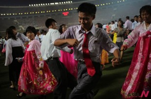 Young North Koreans participate in a mass dance party at the Kim Il Sung stadium, Sunday, July 28, 2013,  during the festivities for the North Korean's celebrations marking the 60th anniversary of the Korean War armistice in Pyongyang, North Korea. (AP Photo/Wong Maye-E)