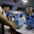 Visitors look at a medical device at China Medical Beauty and Plastic Surgery Equipment Exhibition in Shanghai, China, Wednesday, June 5, 2013. (AP Photo/Eugene Hoshiko)