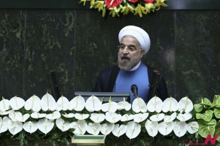 Iran's new President Hasan Rouhani delivers a speech after his swearing-in at the parliament in Tehran, Iran, Sunday, Aug. 4, 2013. Rouhani replaced Mahmoud Ahmadinejad, who was in power since 2005. The president on Sunday called on the West to abandon the "language of sanctions" in dealing with his country over its contentious nuclear program, hoping to ease the economic pressures now grinding its people. (Photo: AP Photo/Ebrahim Noroozi)
